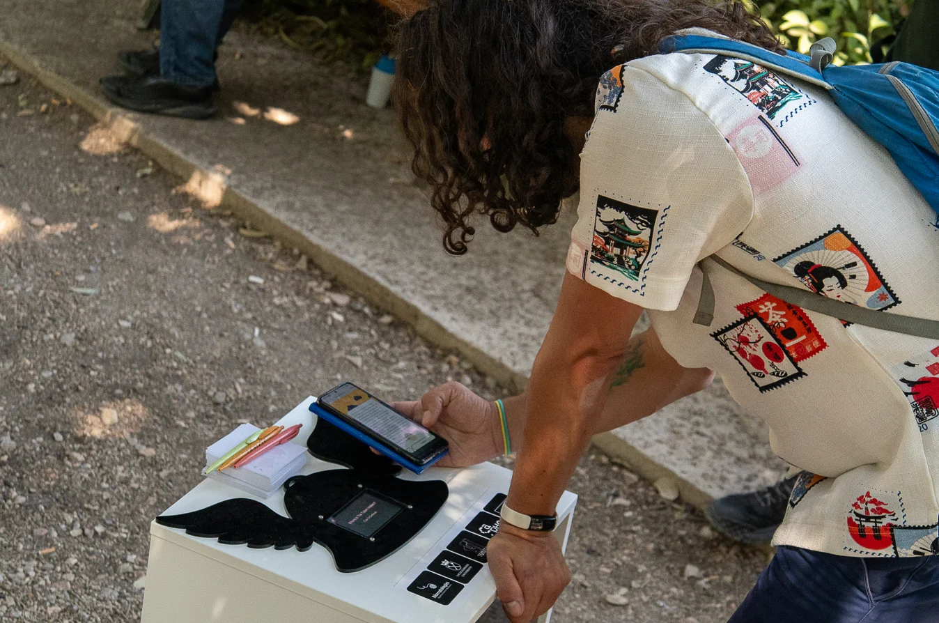 Researcher testing mobile devices and sensors during intelligent systems experimentation.