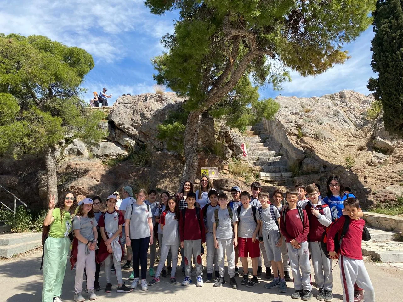 Group of students gathered during an educational day trip at a historic site in Greece.